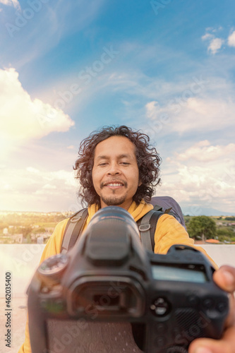 Travel man making content video on camera for travel blog © @Nailotl