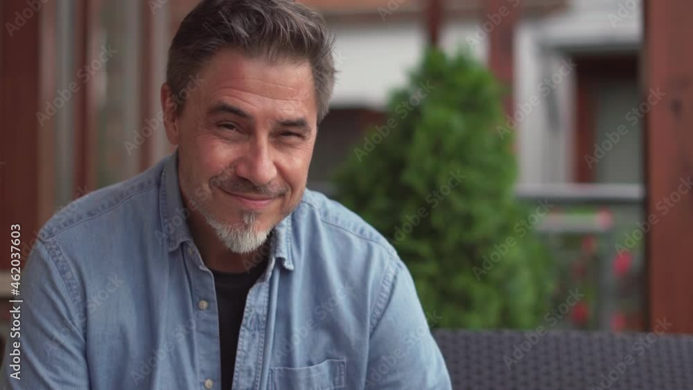 Outdoor portrait of mid adult man in 50s, happy confident smile. Mature age, middle age, bearded, Outdoor portrait of mid adult man in 50s, happy confident smile. Mature age, middle age, bearded,
