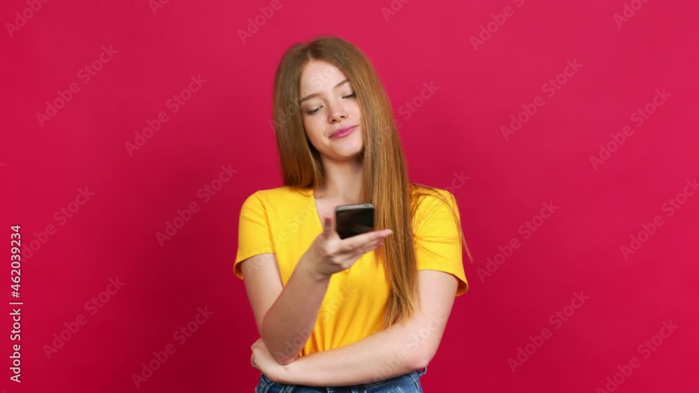 Teenager girl using mobile phone over isolated background Teenager girl using mobile phone over isolated background