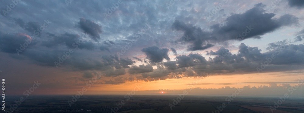 Panorama of the sky with clouds at sunset