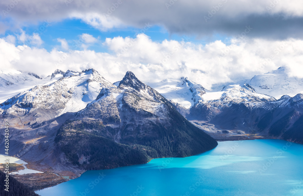 Canadian Rocky Mountain landscape and Garibaldi Lake. Sunny and cloudy Fall Day. Taken from top of Panorama Ridge, located near Whister and Squamish, North of Vancouver, BC, Canada.