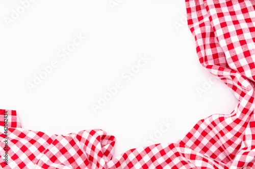 Fabric textile crumpled on white background with copy space. Tablecloth picnic Red, white texture checkers. on white background.