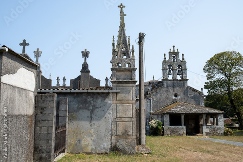 LUGO, SPAIN; AUGUST 23, 2021: Small gothic style cemetery next to churches in small town in northern Spain
