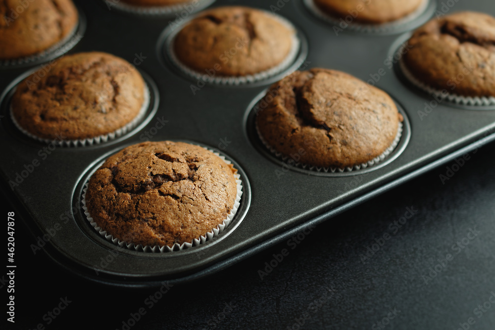 Homemade chocolate muffins in a baking dish