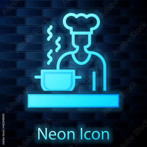 Glowing neon Spanish cook icon isolated on brick wall background. Vector