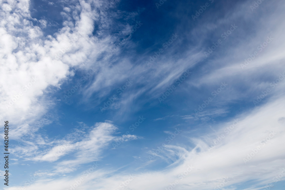 Cirrocumulus and cumulonimbus clouds on an autumn day