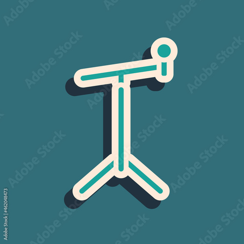 Green Microphone with stand icon isolated on green background. Long shadow style. Vector