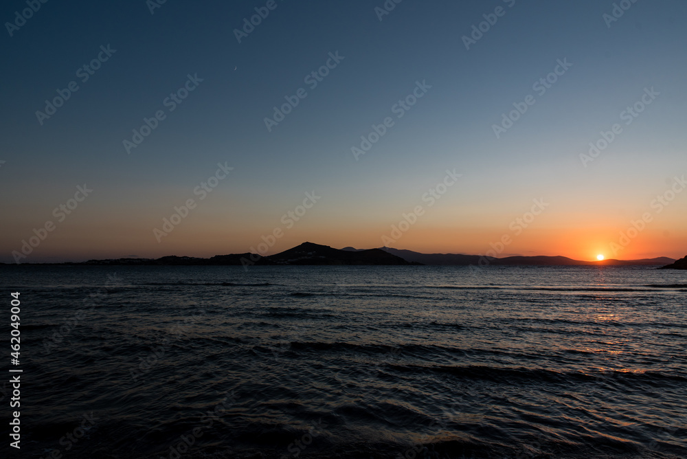 Sunset at Agios Georgios beach in Chora of Naxos island, Cyclades, Greece