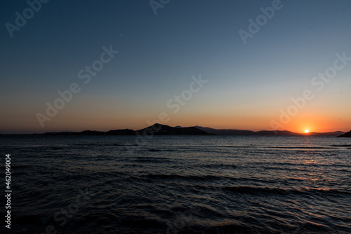 Sunset at Agios Georgios beach in Chora of Naxos island  Cyclades  Greece