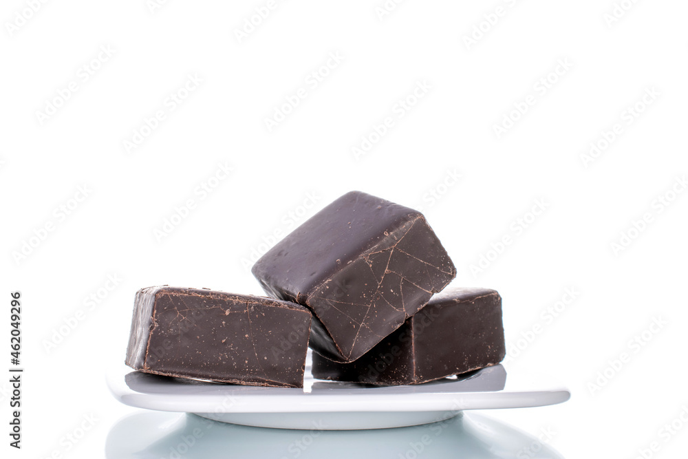 Several sweet chocolates with ceramic dishes, close-up, isolated on white. Several sweet chocolates with ceramic dishes, close-up, isolated on white.