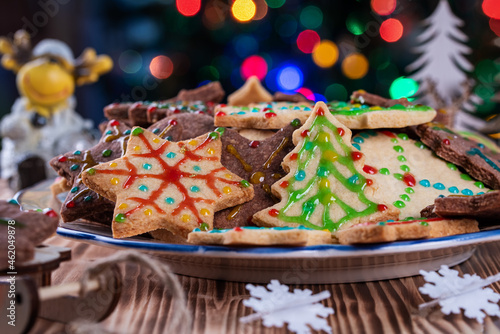 Homemade Christmas pastries on the background of Christmas tree lights. Homemade cookies.