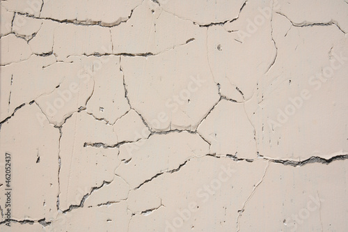 Overlay for your design. Background texture of a white cement wall with a crack. A crack in the old wall. High quality photo