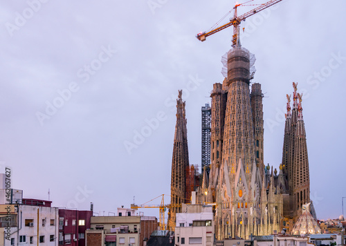 Early Morning View of the Sagrada Familia With Lighting Still On and Cloudy Skies