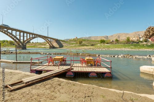 Floating dining room of a restaurant on the waters of the Tigris river in Turkey © Toyakisfoto.photos