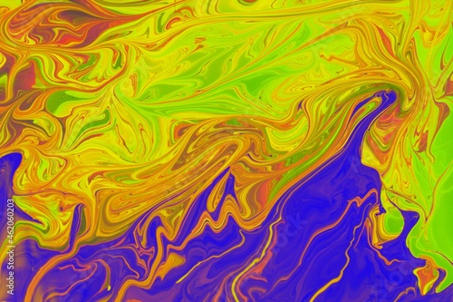 Abstract background of purple and yellow marble. Acrylic paint mixes freely and creates an interesting pattern. Bright saturated shades. Background for the cover of a laptop, laptop.