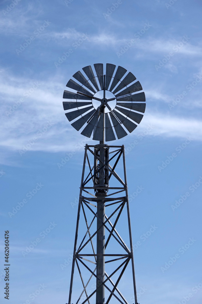 Modern windmill wheel on a metal tower construction