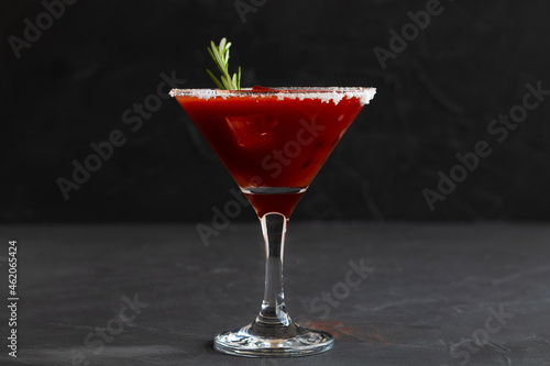 cocktail on black.Bloody Mary cocktail. Alcoholic drink with vodka and tomato juice in a glass isolated on a black background with copy space.