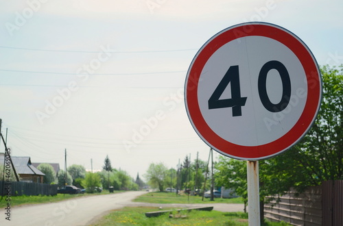 Road sign on the background of a village road