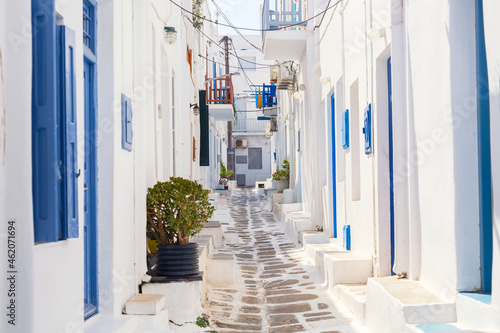 Fototapeta Naklejka Na Ścianę i Meble -  Famous old town narrow street with white houses. Mykonos island, Greece