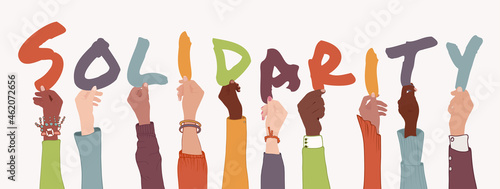 Raised arms of diverse multi-ethnic and multicultural people holding colorful letters forming the text -Solidarity-. Help support and assistance concept