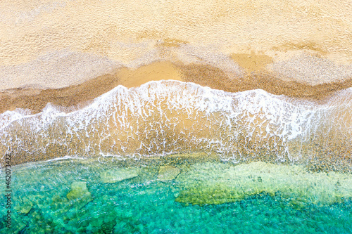 Top view aerial drone photo of beautiful beach with turquoise water and sea waves. Vacation travel background. Ionian sea, Kefalonia Island, Greece