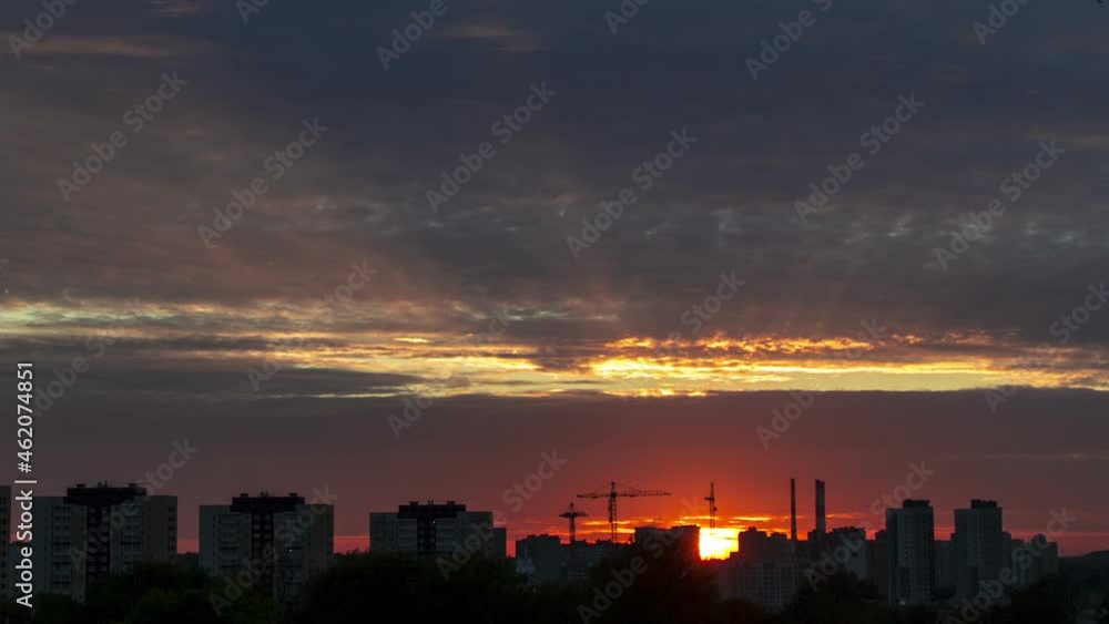 Townscape with clouds at sunset, time lapse. Townscape with clouds at sunset, time lapse.