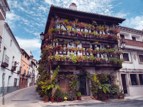 Traditional Spanish wooden house in the province of Avila decorated with flowers.