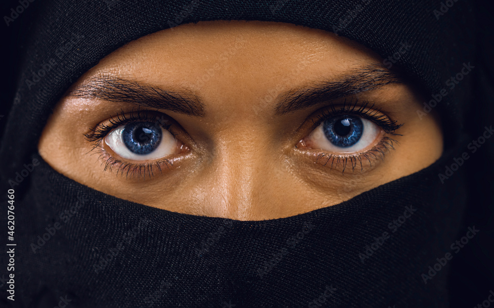 beautiful Arabic woman in hijab with bright makeup and blue eyes. beautiful Arabic woman in hijab with bright makeup and blue eyes.