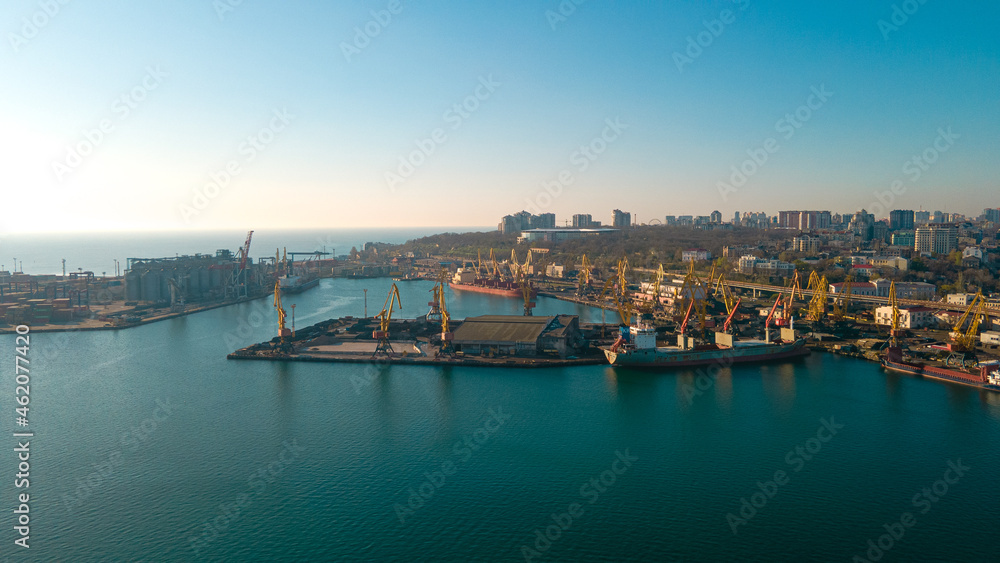 Industrial port in the field of import-export global business logistics and transportation, Loading and unloading container ships, cargo transportation from a bird's eye view.
