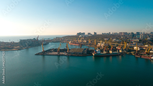 Industrial port in the field of import-export global business logistics and transportation, Loading and unloading container ships, cargo transportation from a bird's eye view.