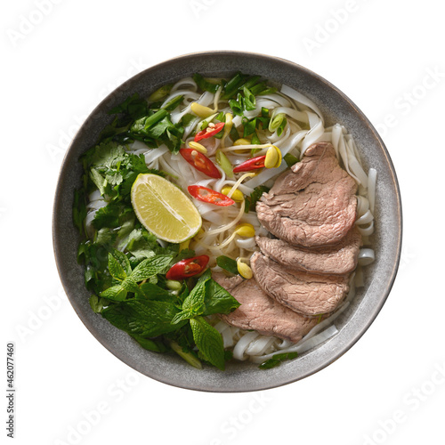 Pho Bo Soup with beef, rice noodles, lime, chili pepper in gray bowl isolated on white backgound. Vietnamese cuisine.