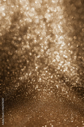 Golden glitter background with small particles