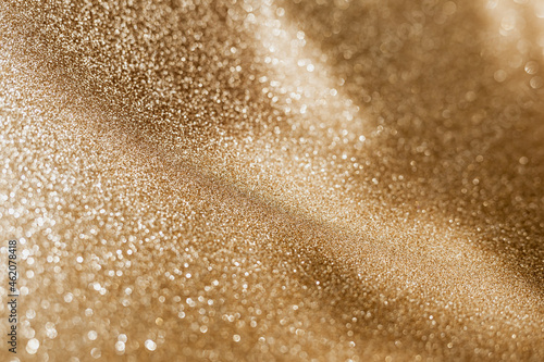 Golden glitter background with small particles