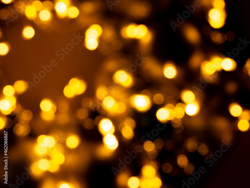 Abstract blurry background, golden bokeh lights and flares - Christmas background