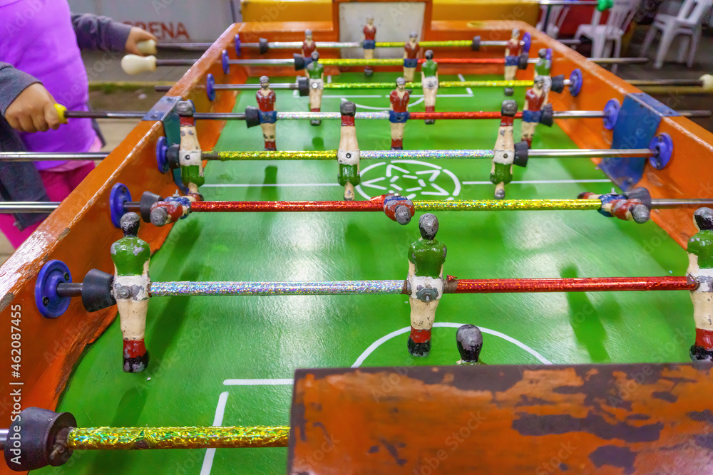 children playing table football in fair