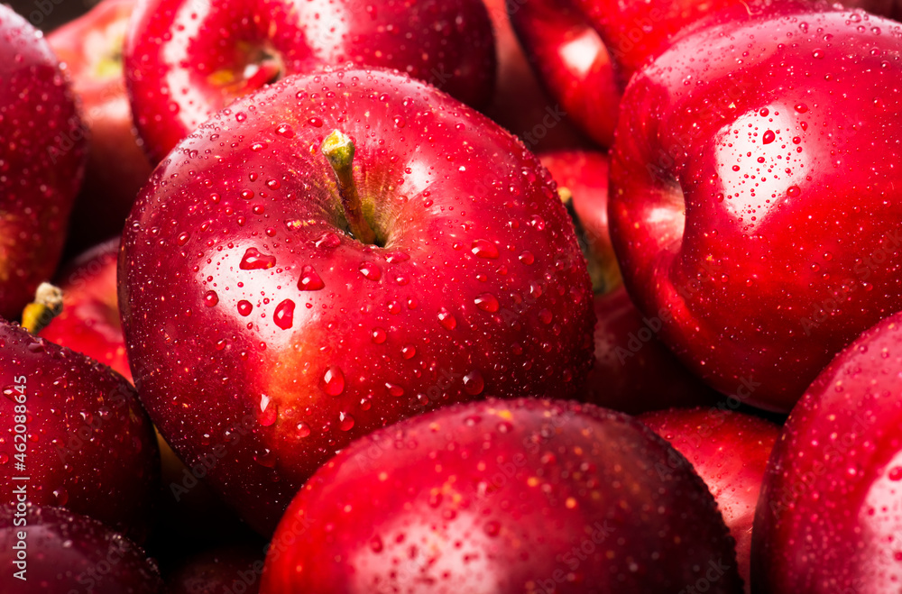 Red apples background with water drops Red apples background with water drops