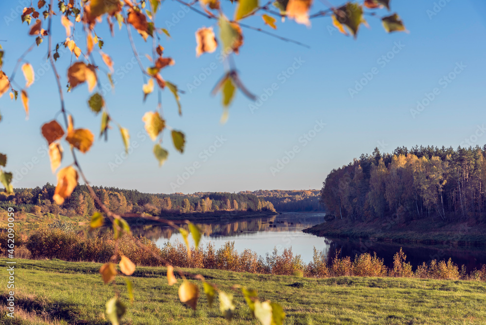 Landscape view on the bend of Daugava river and at Naujene parish, Daugavpils district, Latgale region, Latvia, which is a part of Nature Park “Daugavas Loki” at autumn - obrazy, fototapety, plakaty 
