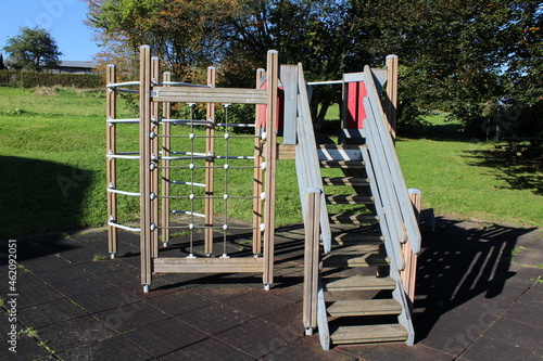 playground in a park with stairs and slide