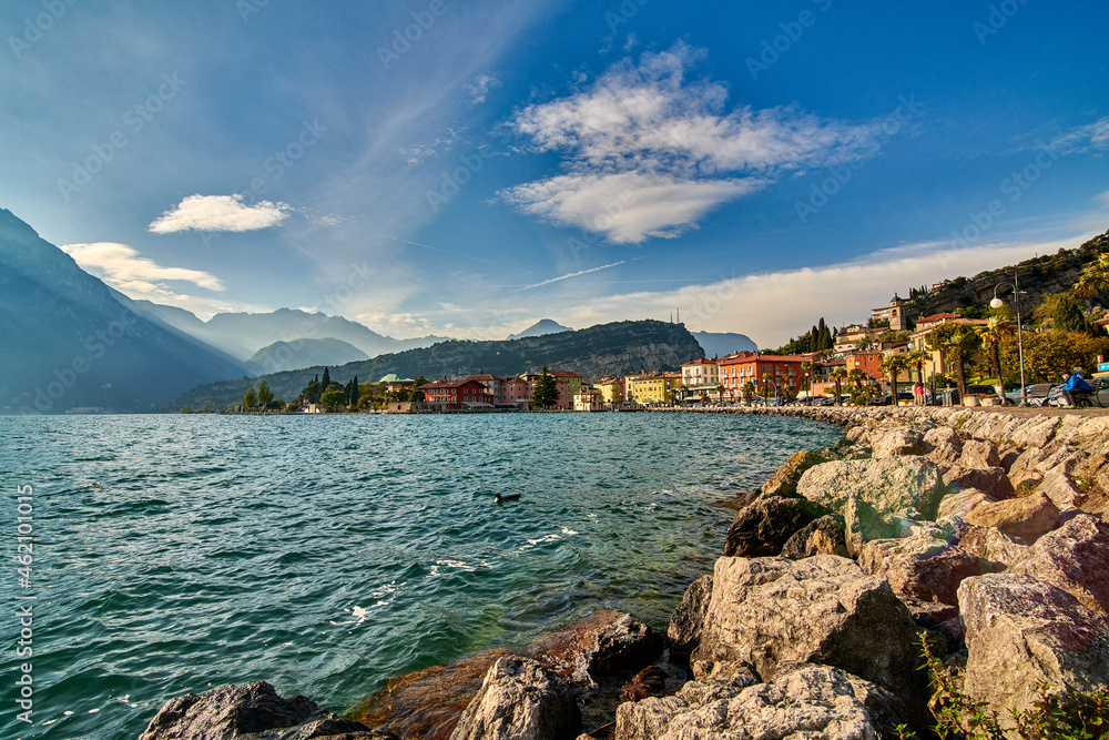 Panorama of Torbole a small town on Lake Garda, Italy. Europa..Soft focus due to long exposure shot,beautiful Lake Garda surrounded by mountains in the summer time