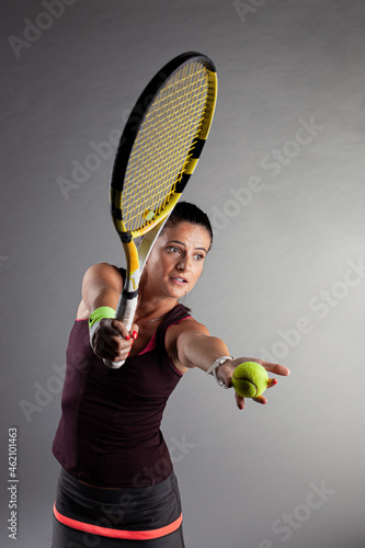 Professional female tennis player. Girl swinging racket.. © Nikola Spasenoski