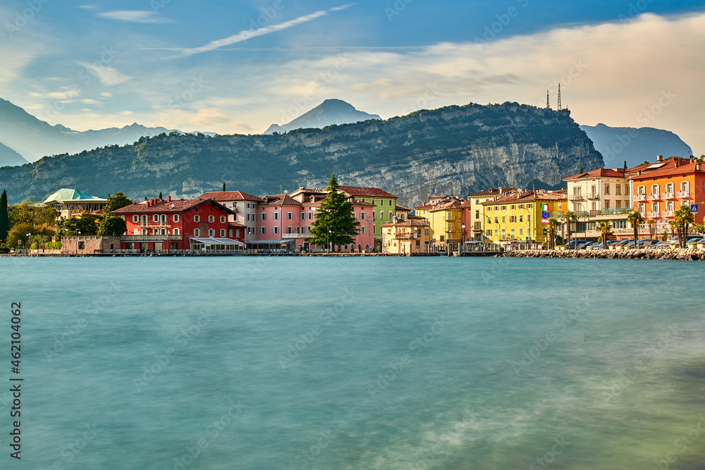 Panorama of Torbole a small town on Lake Garda, Italy. Europa..Soft focus due to long exposure shot,beautiful Lake Garda surrounded by mountains in the summer time