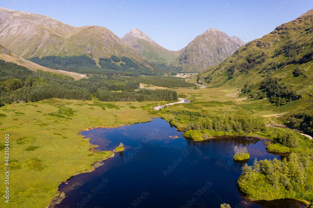 Aerial view of the mountains, forest and lakes of Glen Etive in the Scottish Highlands