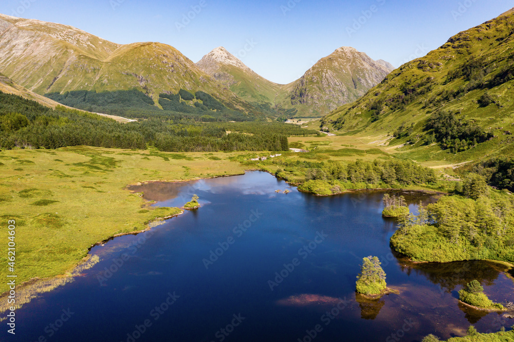 Aerial view of spectacular alpine scenery with Lochs and mountains (Glen Etive, Glencoe, Scotland)