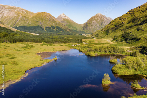 Aerial view of spectacular alpine scenery with Lochs and mountains (Glen Etive, Glencoe, Scotland)