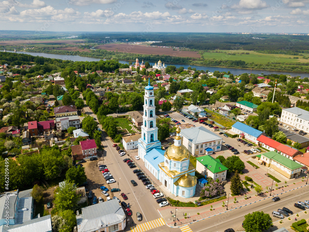 Aerial view of Russian town of Kashira on bank of Oka River overlooking golden dome and multileveled belfry of Vvedenskaya church