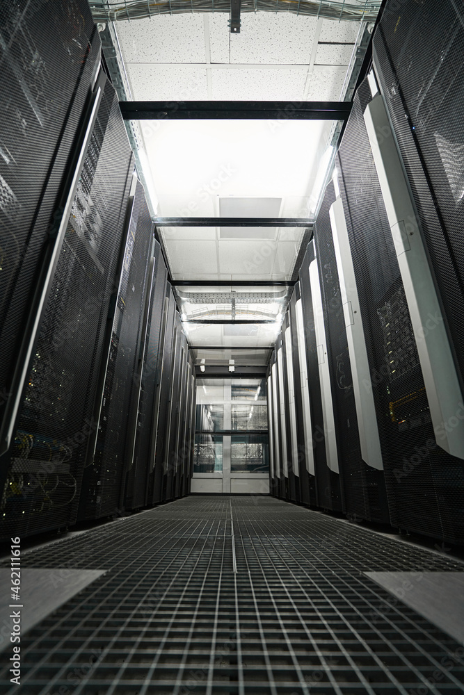 Server racks standing in hallway of data center StockFoto Adobe Stock