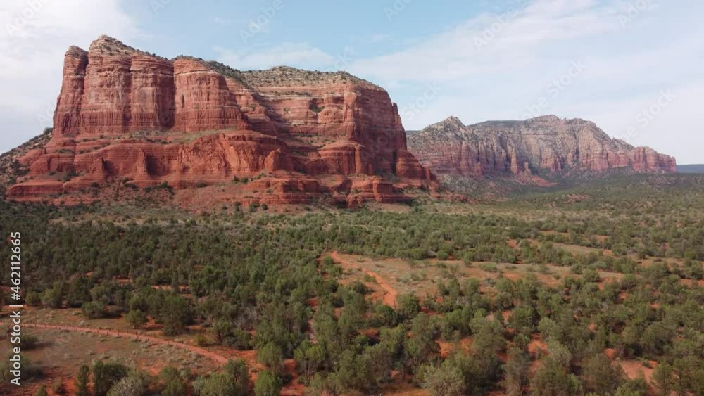 Red desert forest in the heart of the Midwest. Sedona, Arizona. The setting could be a western movie. Calming low altitude flight on the red plains of Sedona. Crane shot Red desert forest in the heart of the Midwest. Sedona, Arizona. The setting could be a western movie. Calming low altitude flight on the red plains of Sedona. Crane shot