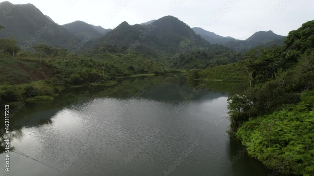 Cinematic Aerial view over green forest jungle with lagoon on summer day in Honduras, Central America. rainforest from above Cinematic Aerial view over green forest jungle with lagoon on summer day in Honduras, Central America. rainforest from above