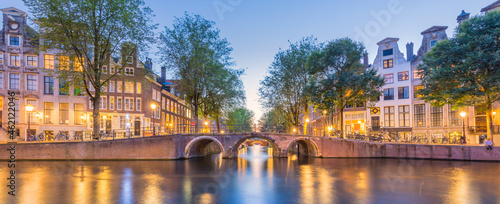 Amsterdam. Panorama view of the historic city center of Amsterdam. Traditional houses and bridges of Amsterdam. A European travel to a historic city. Europe, Netherlands, Holland, Amsterdam.