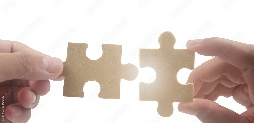 Connecting jigsaw puzzle. Business solutions success and strategy concept Connecting jigsaw puzzle. Business solutions success and strategy concept